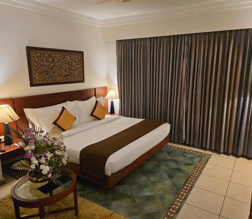 Postel nebo postele na pokoji v ubytování Harrisons Hotel