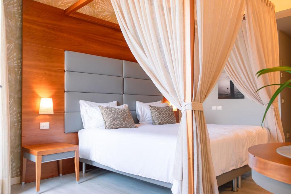 Postel nebo postele na pokoji v ubytování Hotel Corte Valier