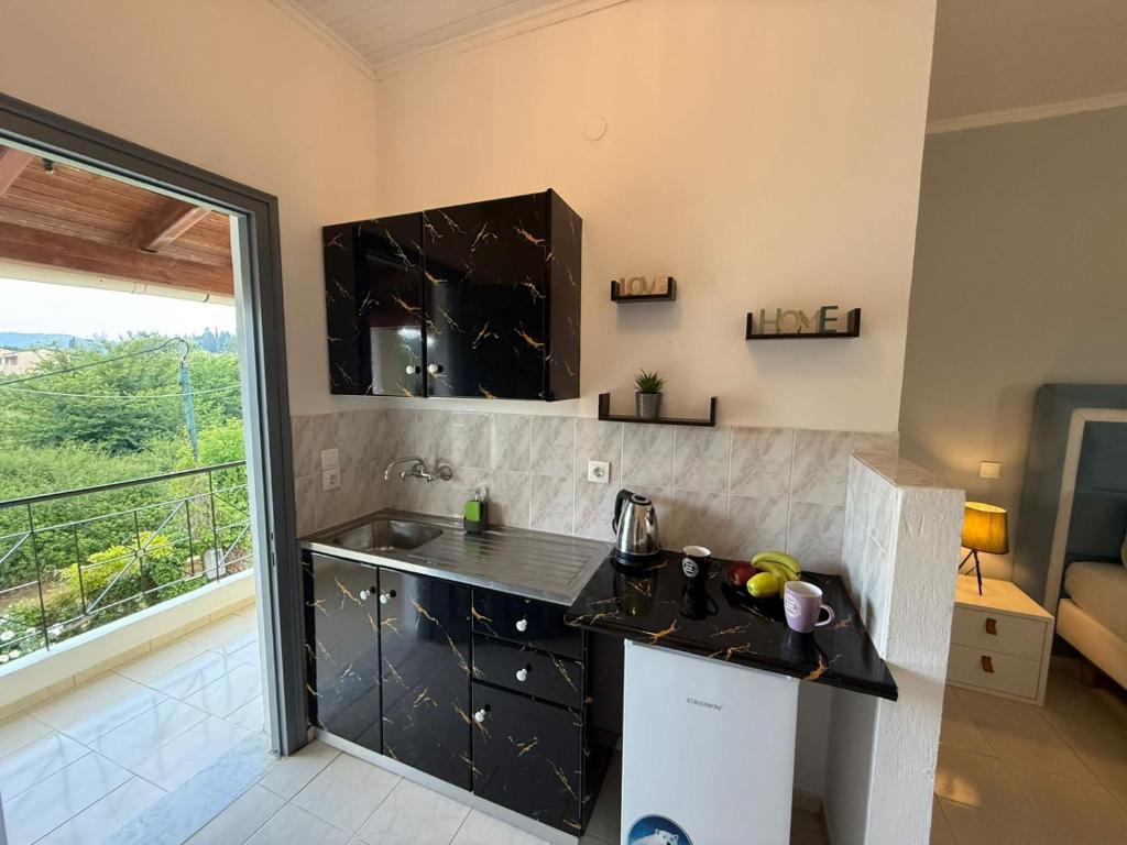 Kuchyň nebo kuchyňský kout v ubytování Melitsa corfu hotel