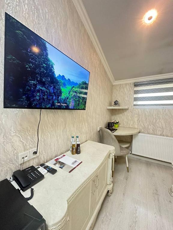 Телевизор и/или развлекательный центр в Ammar hotel