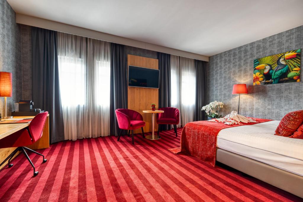 Postel nebo postele na pokoji v ubytování Hotel Verviers Van der Valk