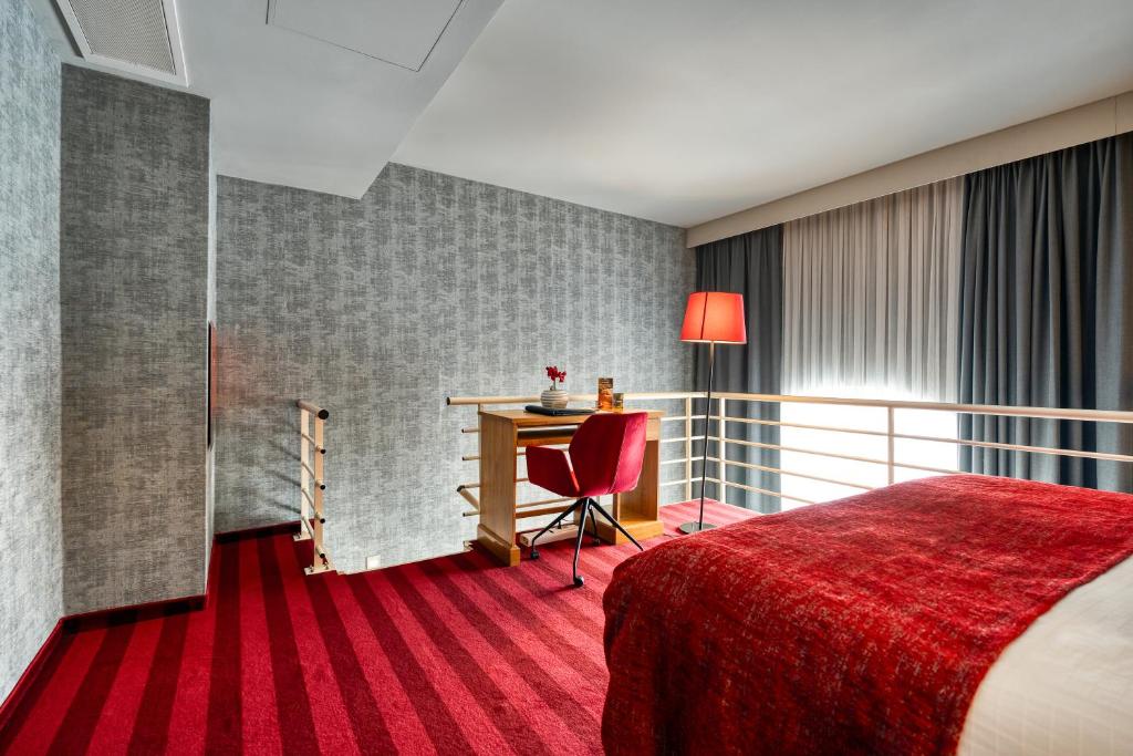 Postel nebo postele na pokoji v ubytování Hotel Verviers Van der Valk
