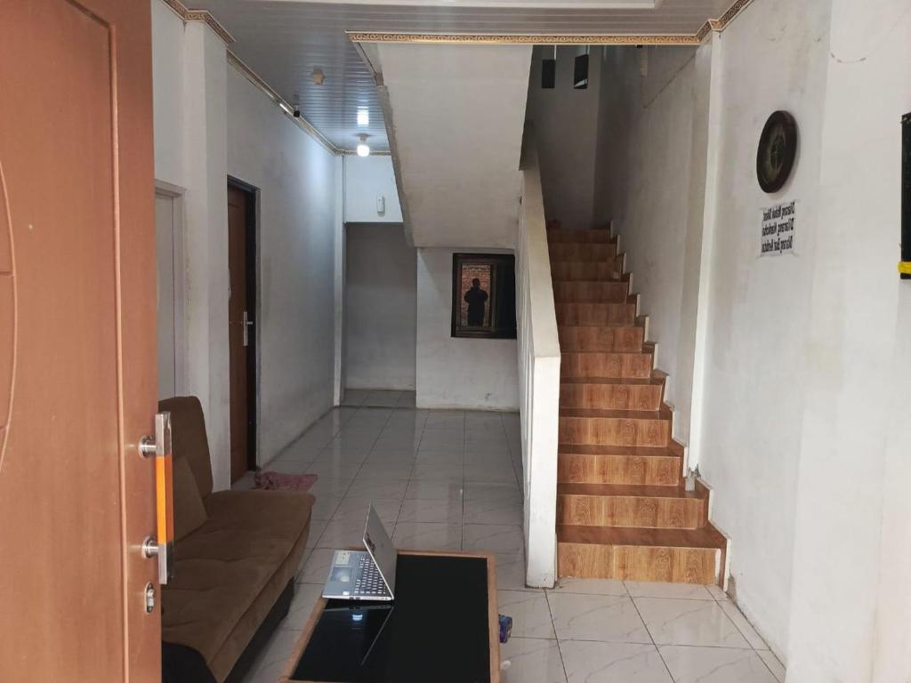 Φωτογραφία από το άλμπουμ του OYO 94563 Mamanu Sukadamai Residence σε Μπογκόρ