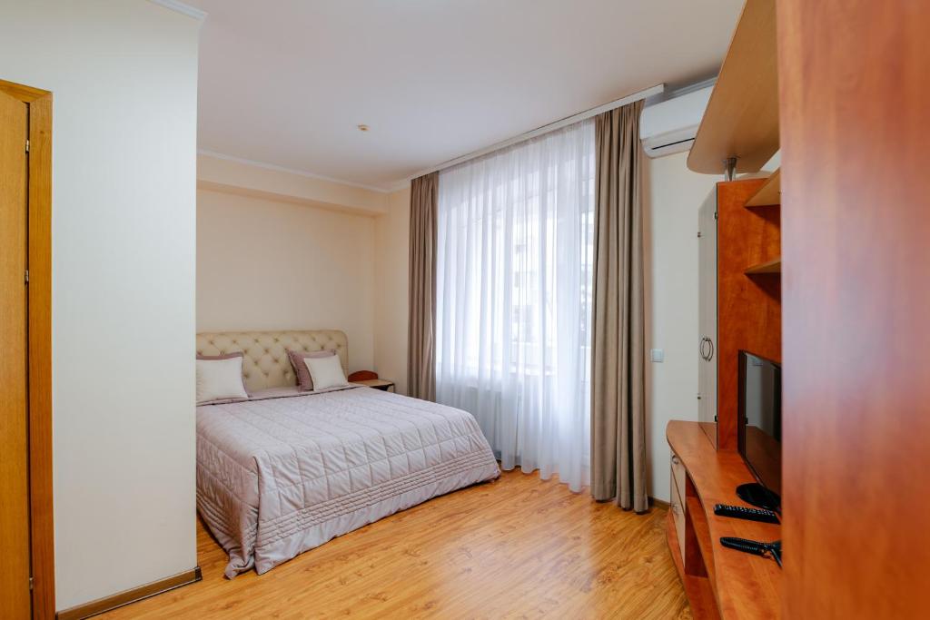 Postel nebo postele na pokoji v ubytování Villa Arus