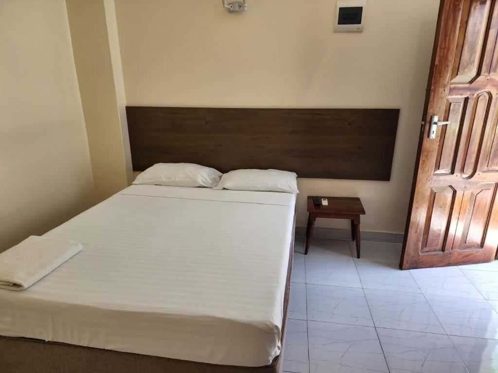 Postel nebo postele na pokoji v ubytování Prestige Leisure Hotel