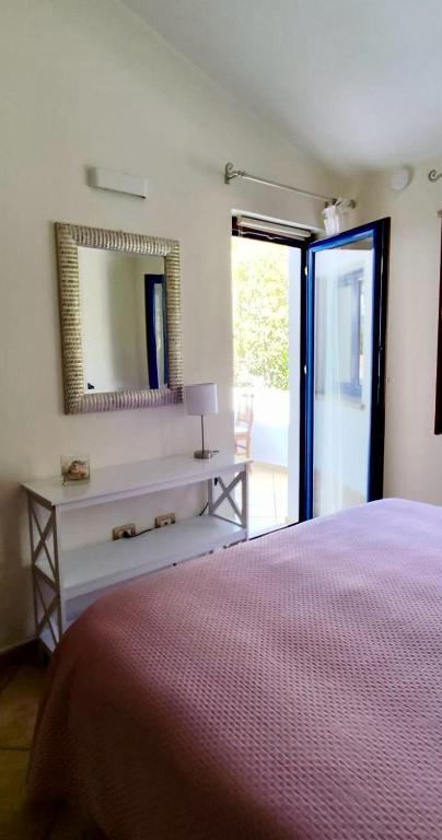 Postel nebo postele na pokoji v ubytování B&B Easy Wind