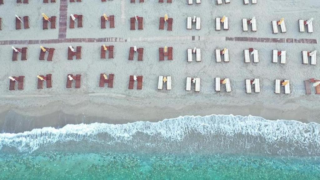 an overhead view of the beach with the ocean at Konstantinos Palace in Karpathos