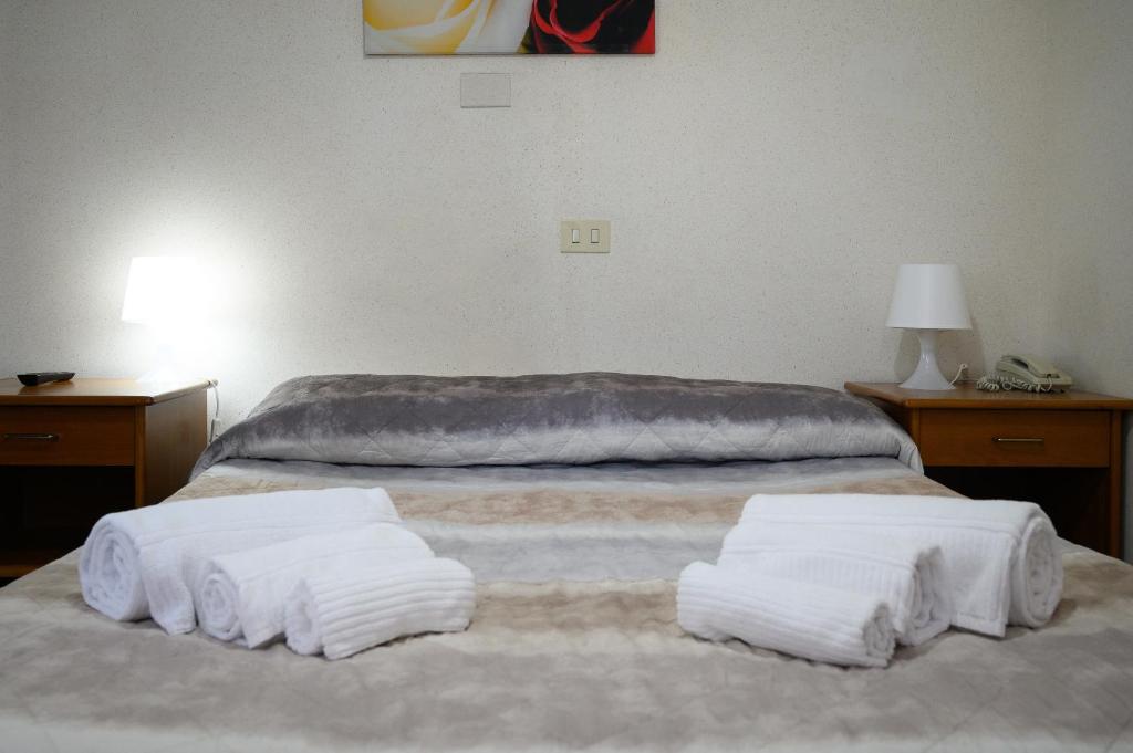 Postel nebo postele na pokoji v ubytování Hotel Casa Tra Noi