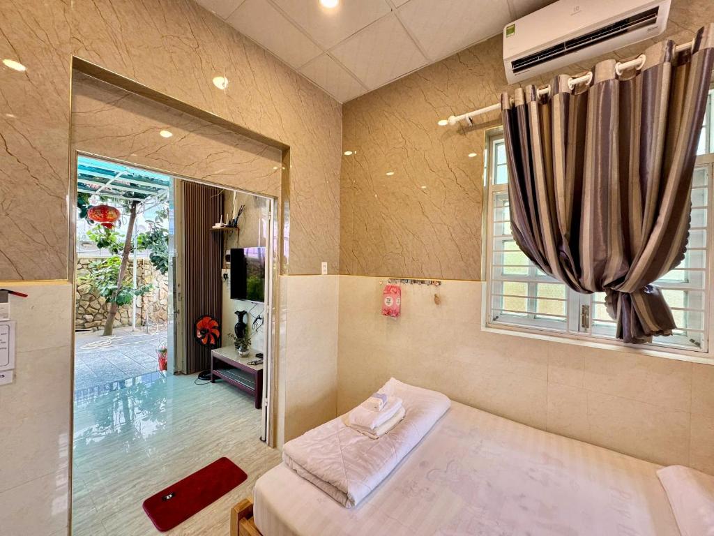 Postel nebo postele na pokoji v ubytování Garden House Nha Trang Homestay - Venuestay