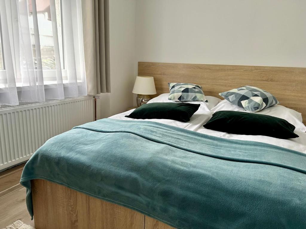 A bed or beds in a room at Jedlinka