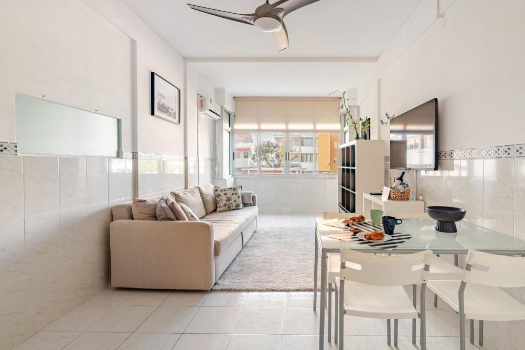 a living room with a couch and a table at Silver Coast by Seareen in Armação de Pêra