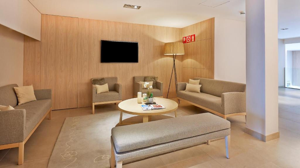 TV a/nebo společenská místnost v ubytování Hotel Omnium