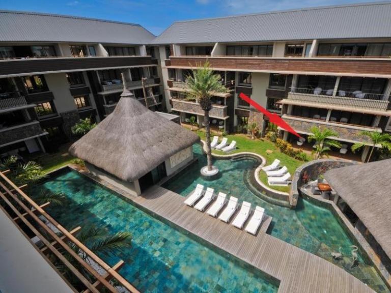 an aerial view of a hotel with a swimming pool at Two-Bedroom Apartment at 'Domaine des Alizées Club & Spa' in Grand Baie