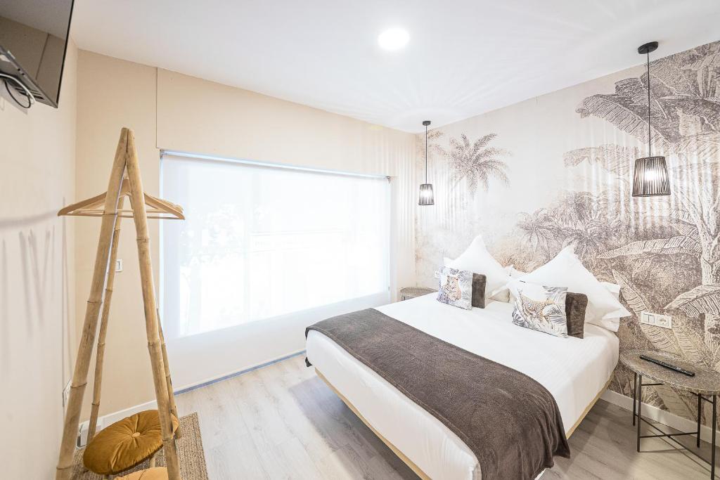 Postel nebo postele na pokoji v ubytování Hostal Plaza Boutique - Solo adultos
