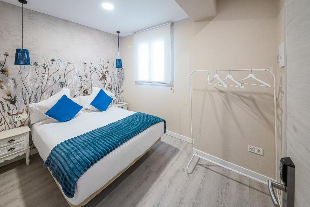 Postel nebo postele na pokoji v ubytování Hostal Plaza Boutique - Solo adultos