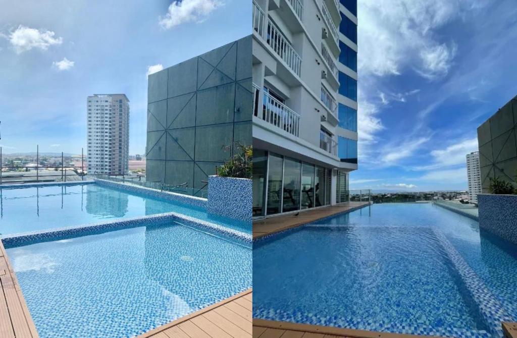 a large swimming pool next to a building at Simple Haven at Inspiria Davao Beside Abreeza Mall - Fully Equipped Studio in Davao City