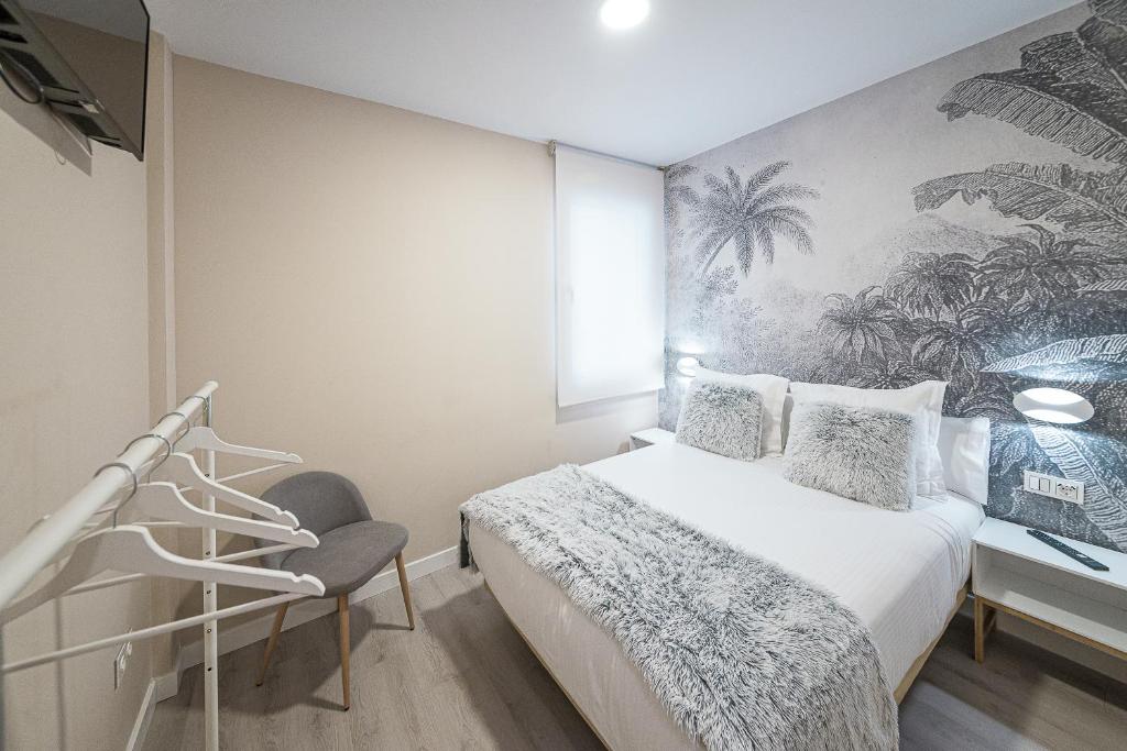 Postel nebo postele na pokoji v ubytování Hostal Plaza Boutique - Solo adultos