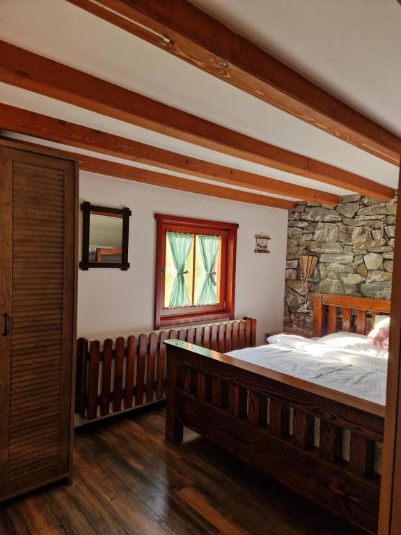 Postel nebo postele na pokoji v ubytování Vikendica Kločanica