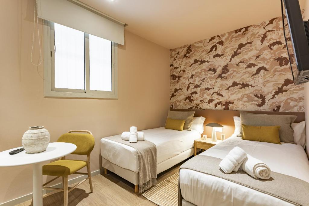 Posteľ alebo postele v izbe v ubytovaní Ola Living Hostal Diagonal