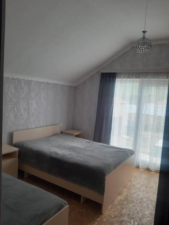 Postel nebo postele na pokoji v ubytování природный апартамент