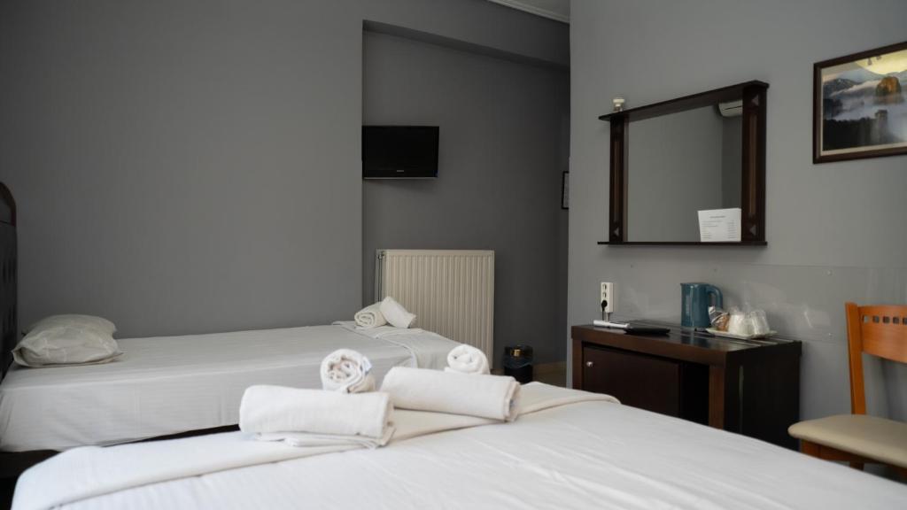 Łóżko lub łóżka w pokoju w obiekcie Toti Boutique Rooms