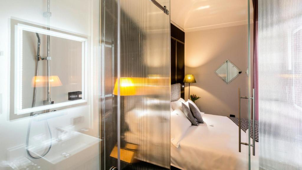Postel nebo postele na pokoji v ubytování Hotel The Haven Roma