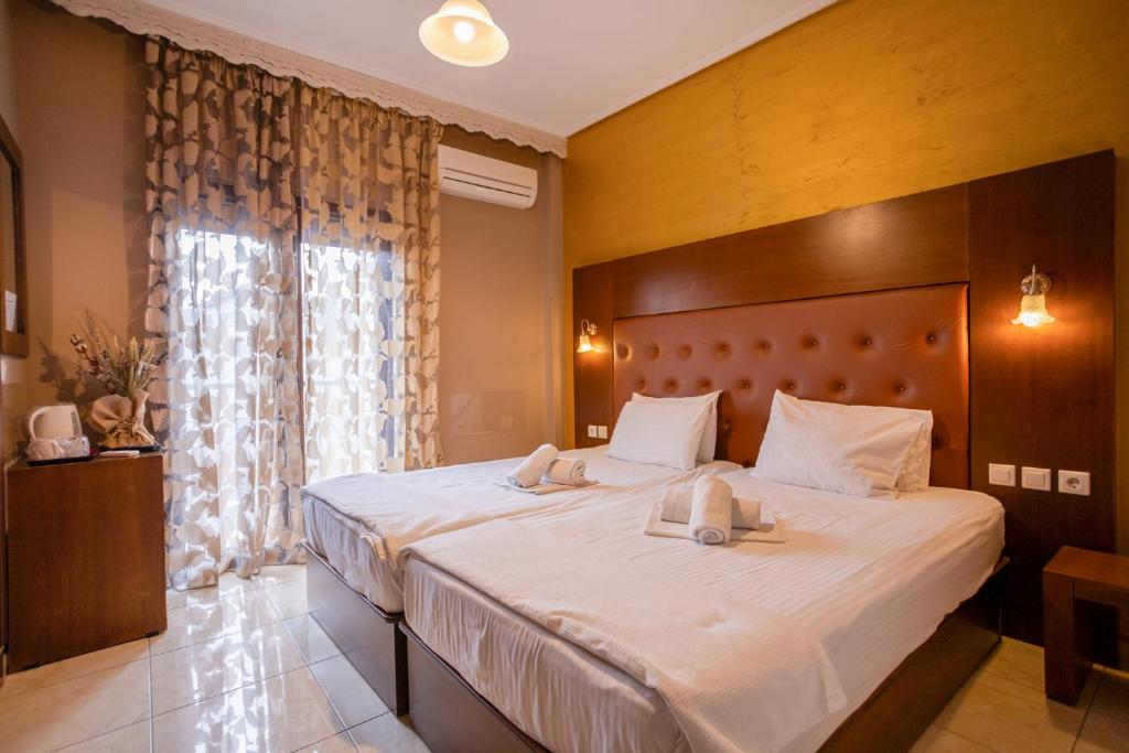 Łóżko lub łóżka w pokoju w obiekcie Toti Boutique Rooms