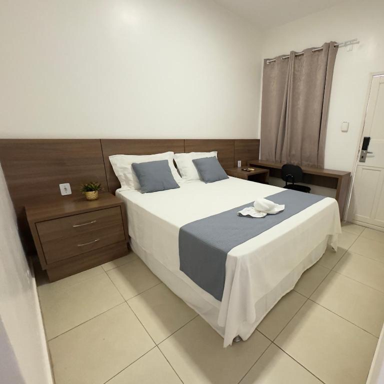 Postel nebo postele na pokoji v ubytování Pousada Brumado