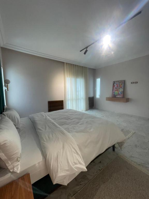 Postel nebo postele na pokoji v ubytování appart hotel lac 2 Tunis
