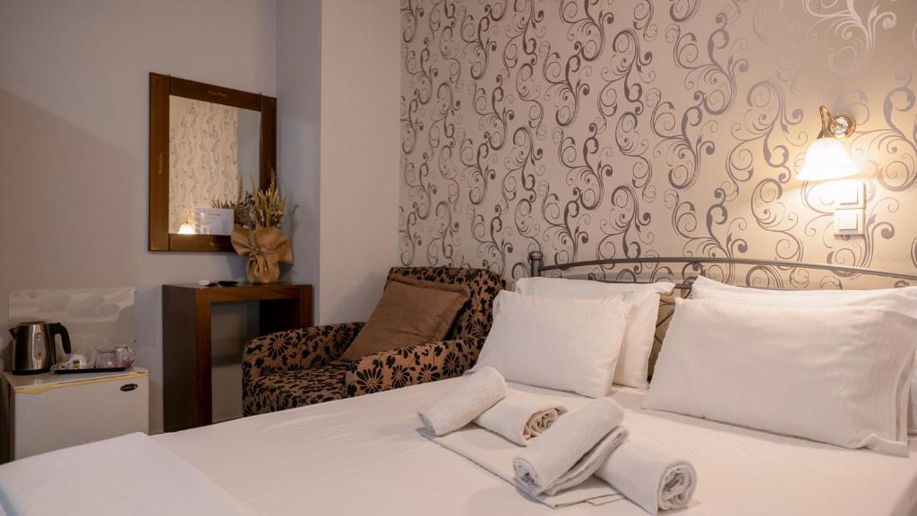 Łóżko lub łóżka w pokoju w obiekcie Toti Boutique Rooms