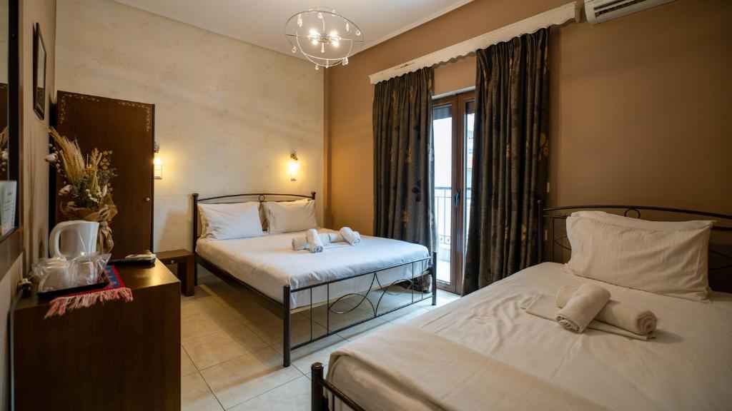 Łóżko lub łóżka w pokoju w obiekcie Toti Boutique Rooms