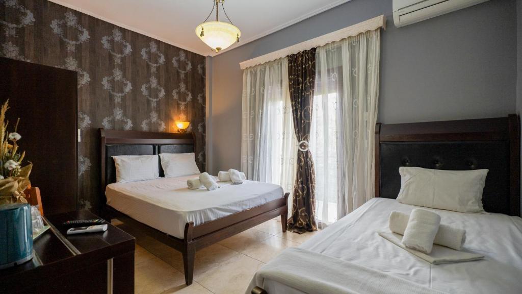 Łóżko lub łóżka w pokoju w obiekcie Toti Boutique Rooms