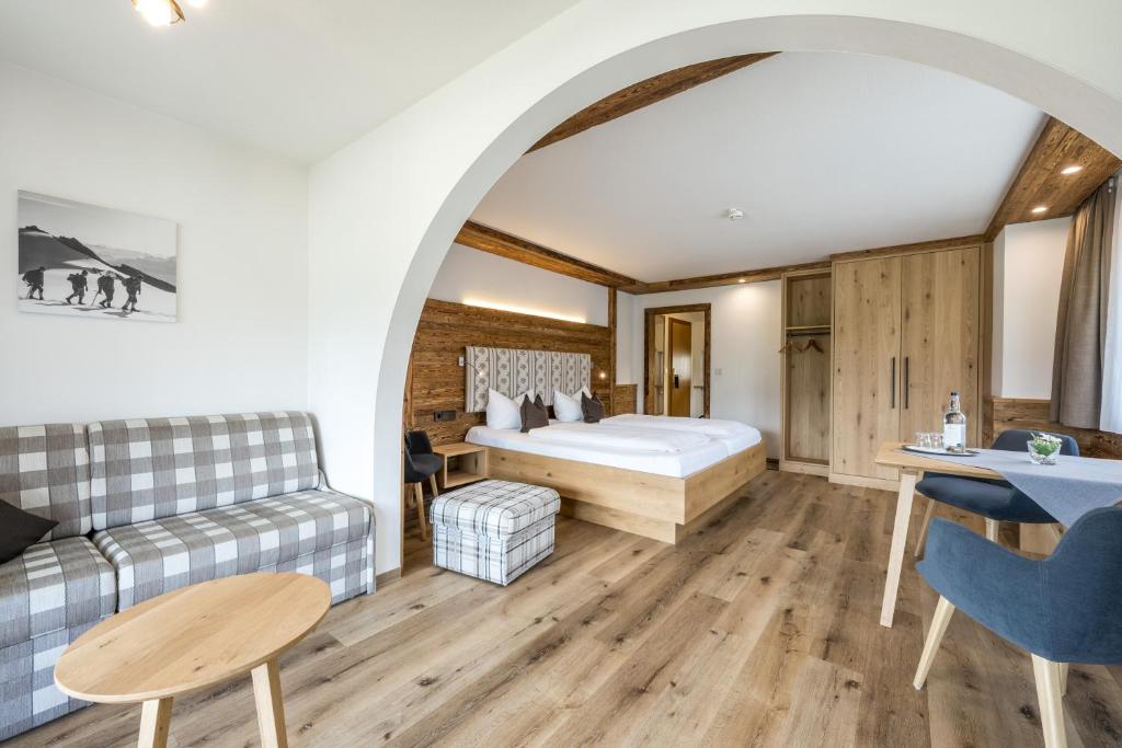 Postel nebo postele na pokoji v ubytování Hotel Garni Schellenberg