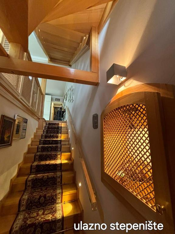 a staircase with a fireplace in a building at Villa Heritage - Old Town - PRIVATE GARAGE in Sarajevo