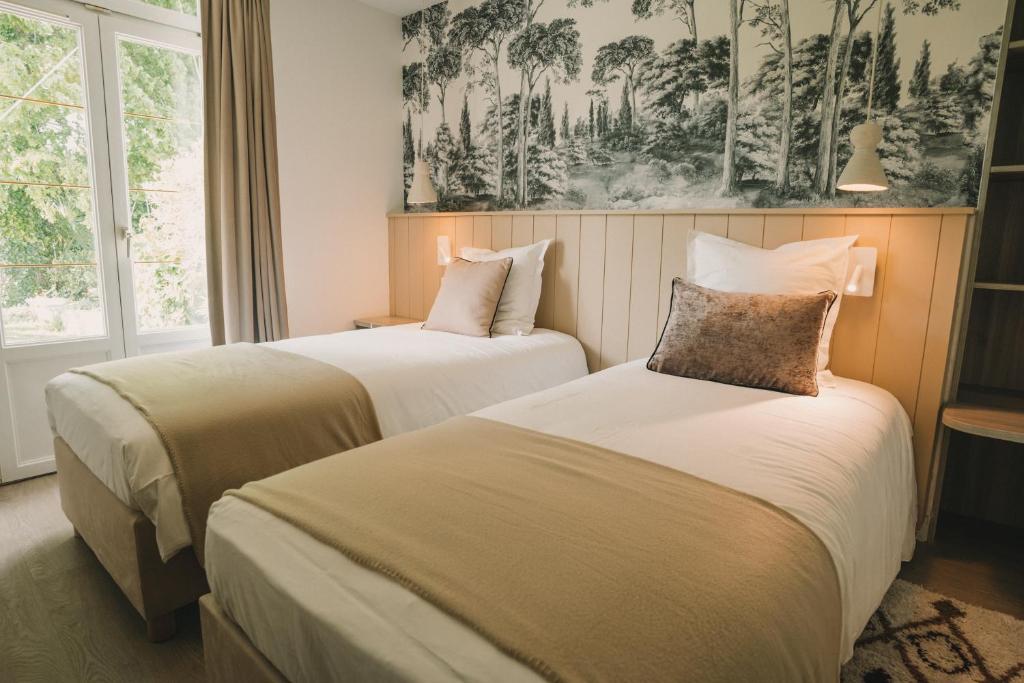 Postel nebo postele na pokoji v ubytování L'Armoric Hôtel - RÉNOVÉ