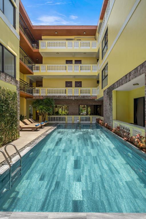 a swimming pool in the middle of a building at Eden Hoi An Villas in Hoi An