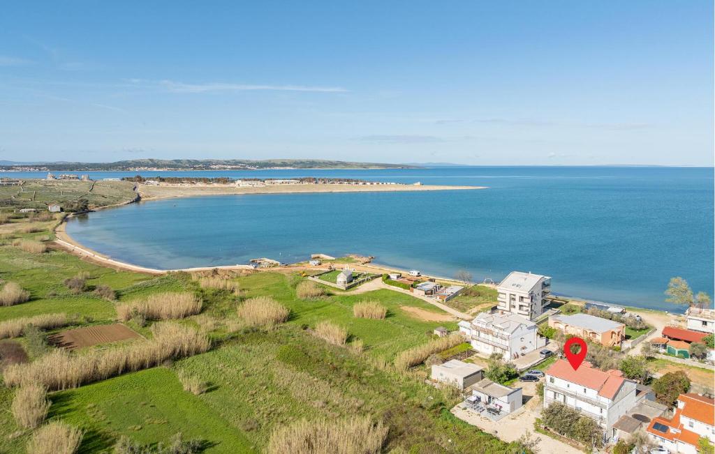 an aerial view of a house and a beach at Amazing Apartment In Povljana With Wifi in Povljana