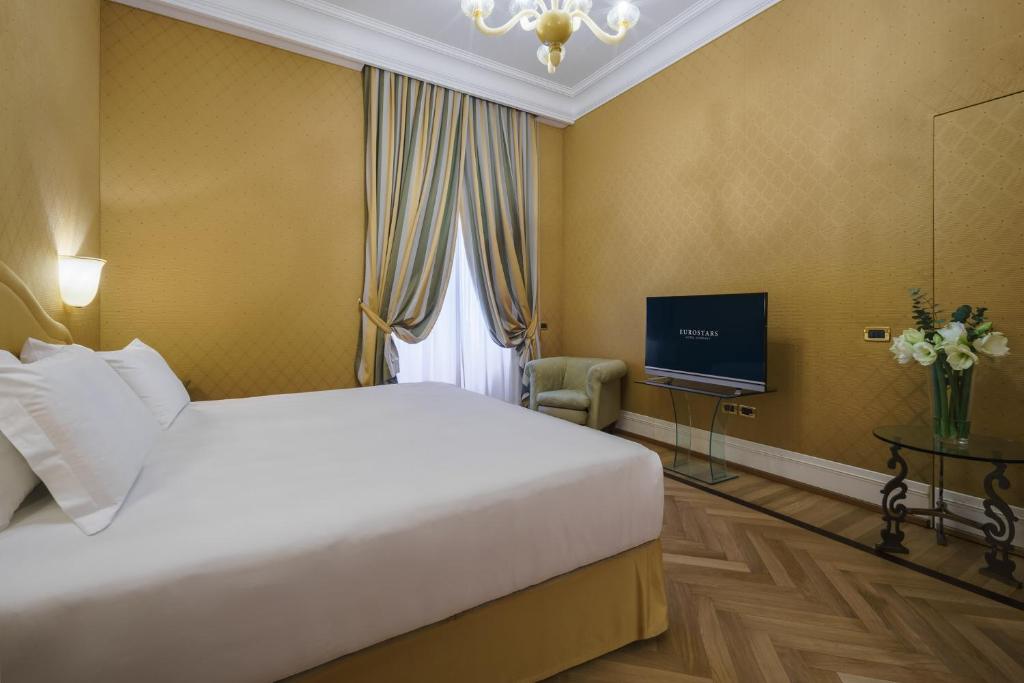 TV a/nebo společenská místnost v ubytování Eurostars Hotel Excelsior