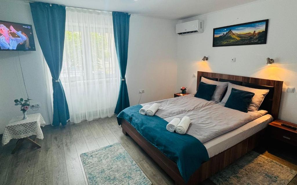 En eller flere senge i et værelse på AMIS Apartment