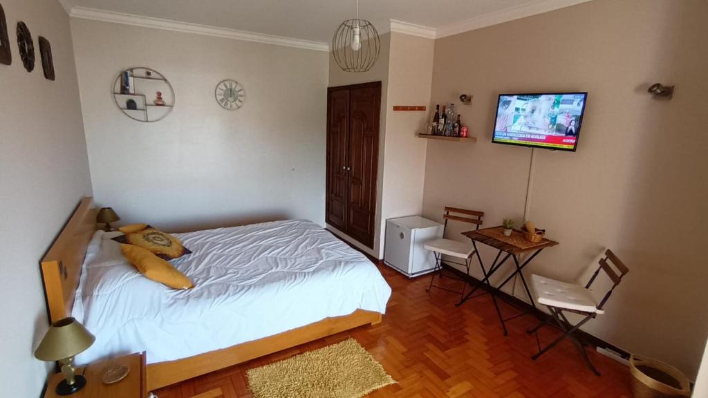 Postel nebo postele na pokoji v ubytování Morada do Ultramar