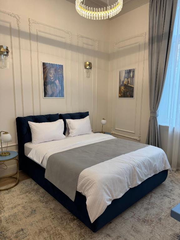 Postel nebo postele na pokoji v ubytování House4You - Praporgescu