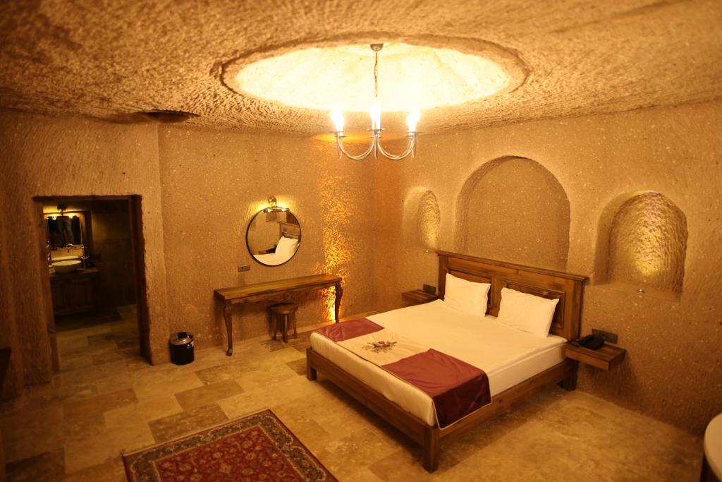 Postel nebo postele na pokoji v ubytování La Fairy Cappadocia