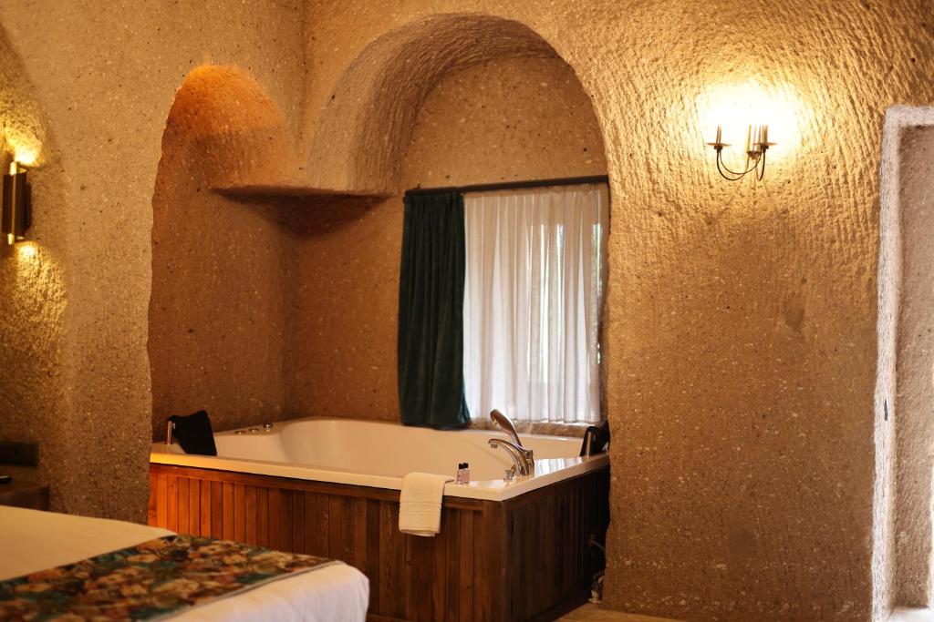 Postel nebo postele na pokoji v ubytování La Fairy Cappadocia