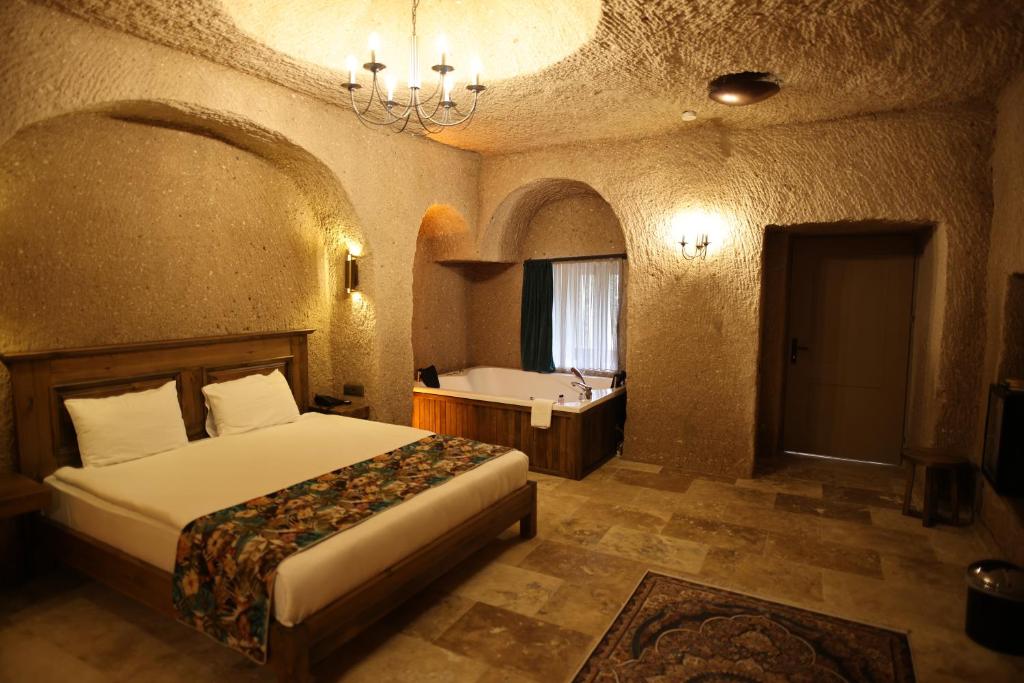 Postel nebo postele na pokoji v ubytování La Fairy Cappadocia