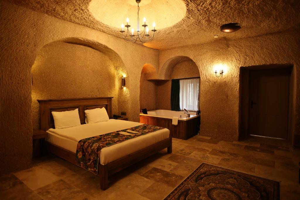 Postel nebo postele na pokoji v ubytování La Fairy Cappadocia