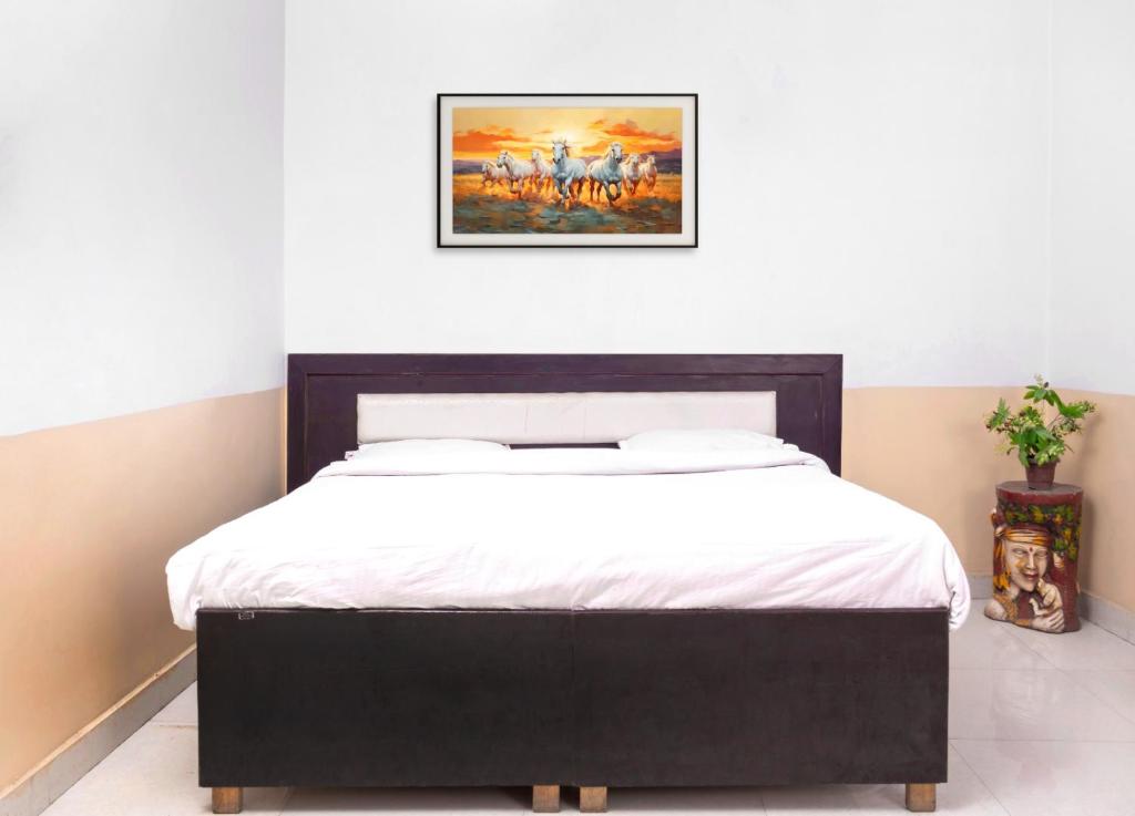 Postel nebo postele na pokoji v ubytování Hotel Sunrise Inn