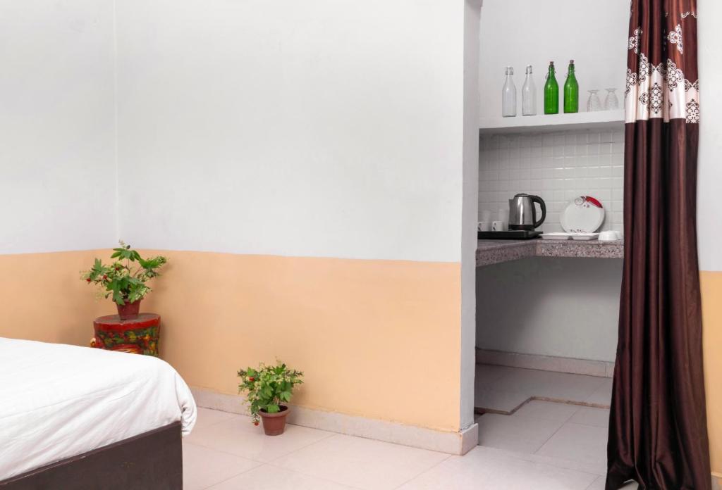 Postel nebo postele na pokoji v ubytování Hotel Sunrise Inn