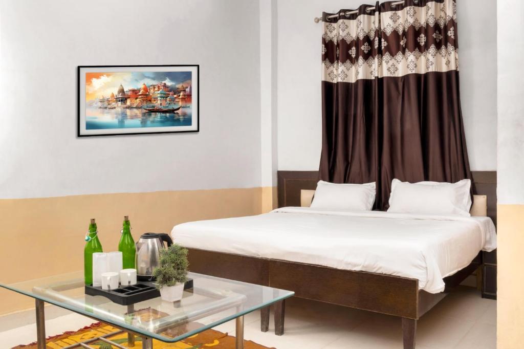 Postel nebo postele na pokoji v ubytování Hotel Sunrise Inn
