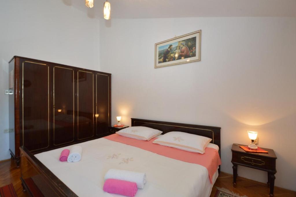Posteľ alebo postele v izbe v ubytovaní House Orhideja