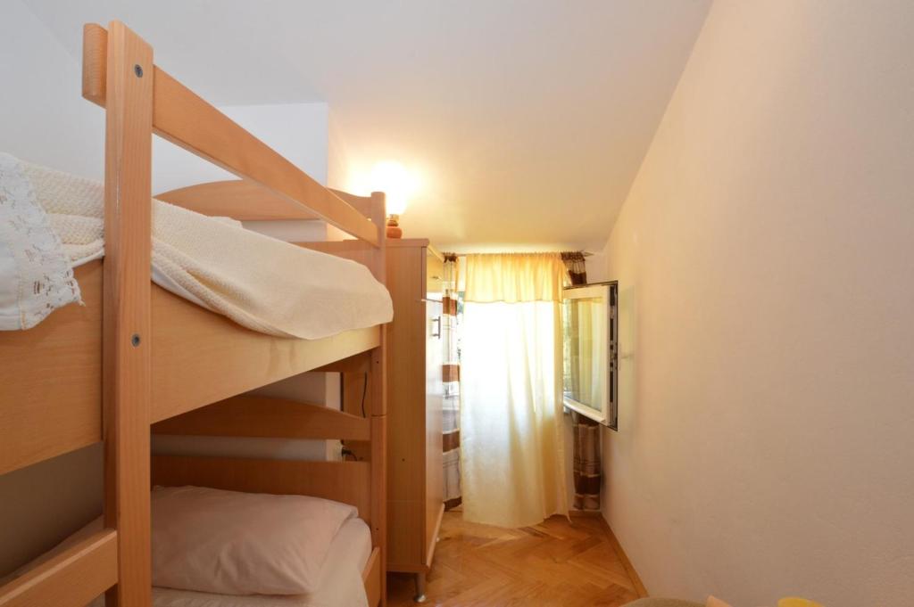 Posteľ alebo postele v izbe v ubytovaní House Orhideja